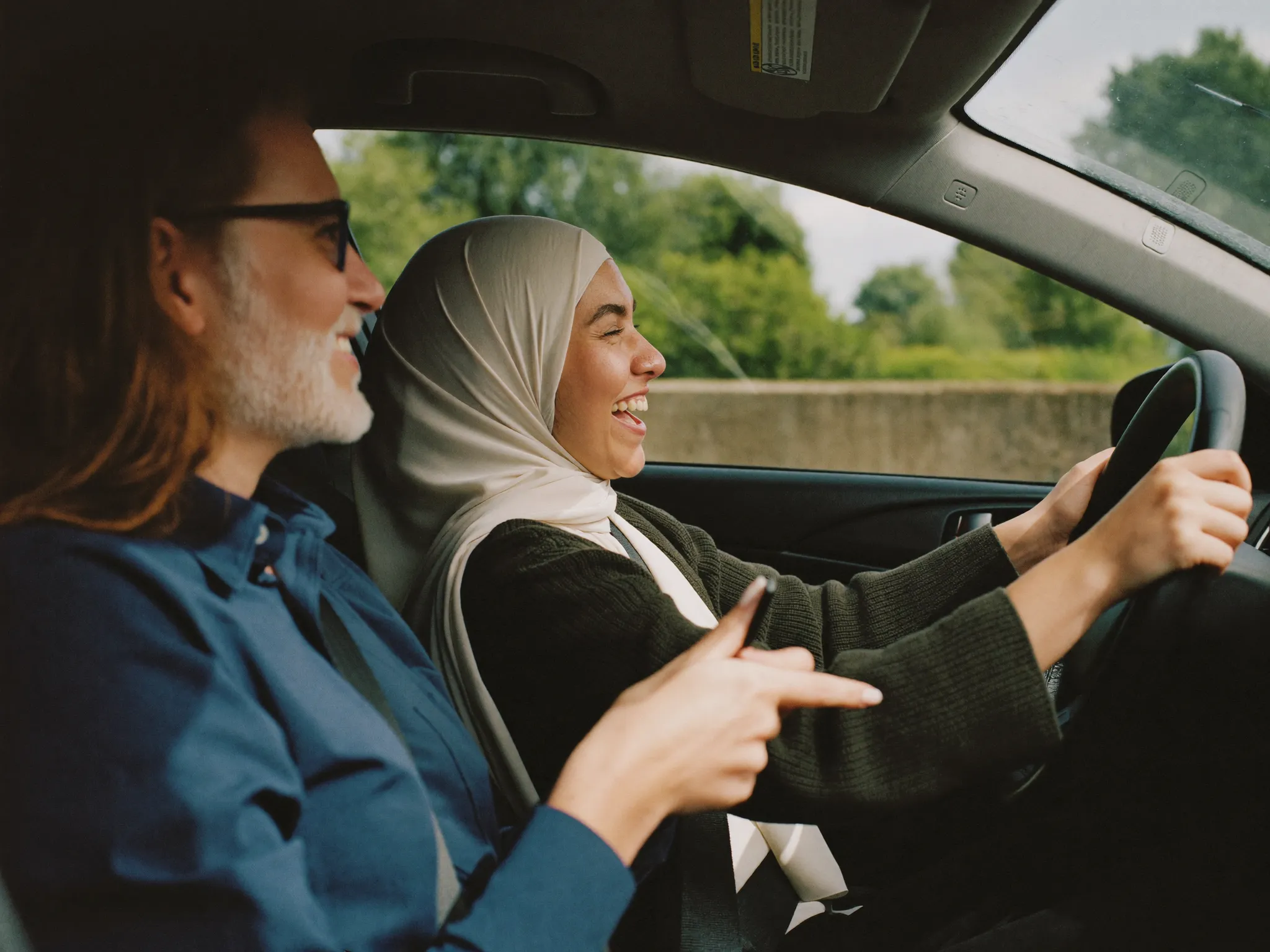 A Learn n Go instructor encouraging a smiling learner driver during a lesson